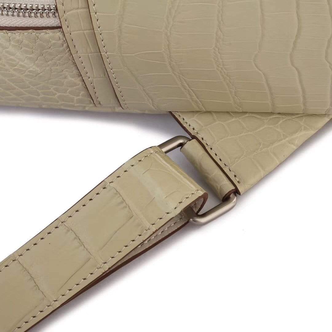 Cream crocodile leather handbag for women by Rossie Viren, featuring a stylish and textured backpack design.