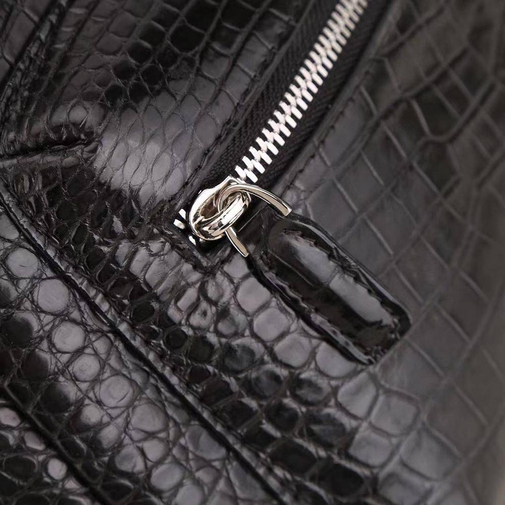 Crocodile leather backpack for women by Rossie Viren, featuring a sleek design with textured crocodile skin and adjustable straps.