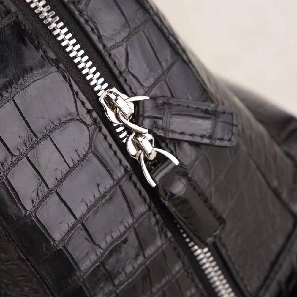 Crocodile leather women's backpack by Rossie Viren featuring a sleek design and textured crocodile pattern.