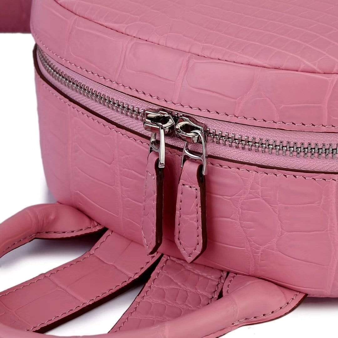 Pink crocodile leather backpack handbag for women by Rossie Viren, featuring a stylish and textured exterior design.