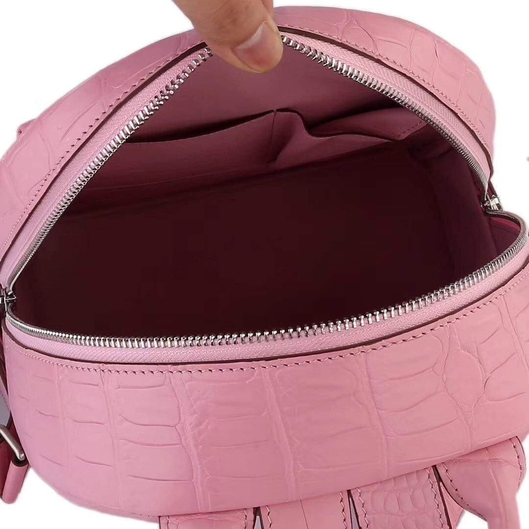 Pink crocodile leather backpack handbag for women by Rossie Viren, featuring a stylish and textured design.