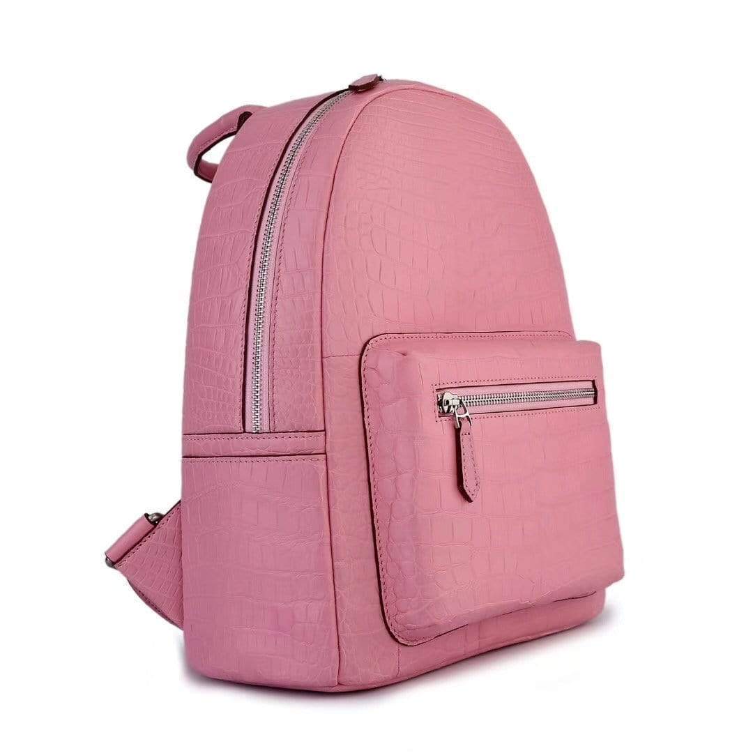 Pink crocodile leather handbag for women by Rossie Viren, featuring a stylish and textured backpack design with adjustable straps.