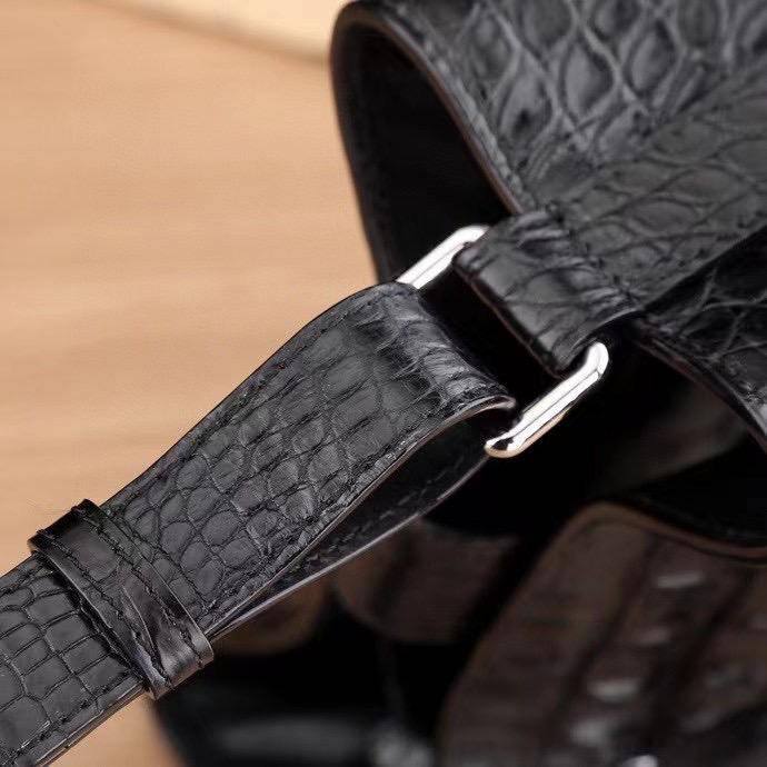 Crocodile leather bucket bag for women by Rossie Viren, featuring drawstring closure, crossbody strap, and hobo tote style handbag.