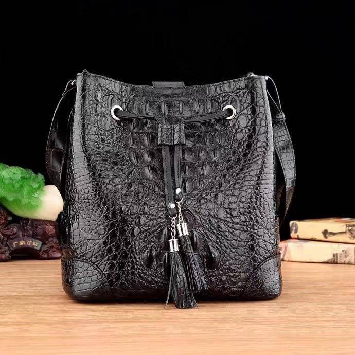 Crocodile leather bucket handbag for women by Rossie Viren with drawstring closure, crossbody strap, and hobo tote style.