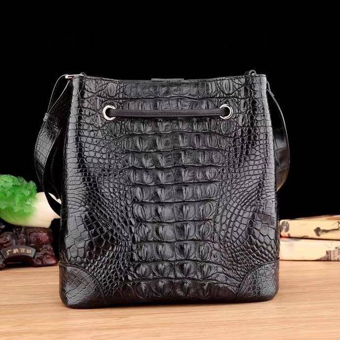 Crocodile leather bucket handbag for women by Rossie Viren, with drawstring closure, crossbody strap, and tote style design.