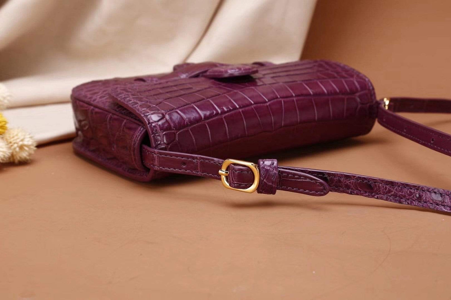 Crocodile leather waist belt messenger bag for girls with adjustable strap and compact design, by Rossie Viren.
