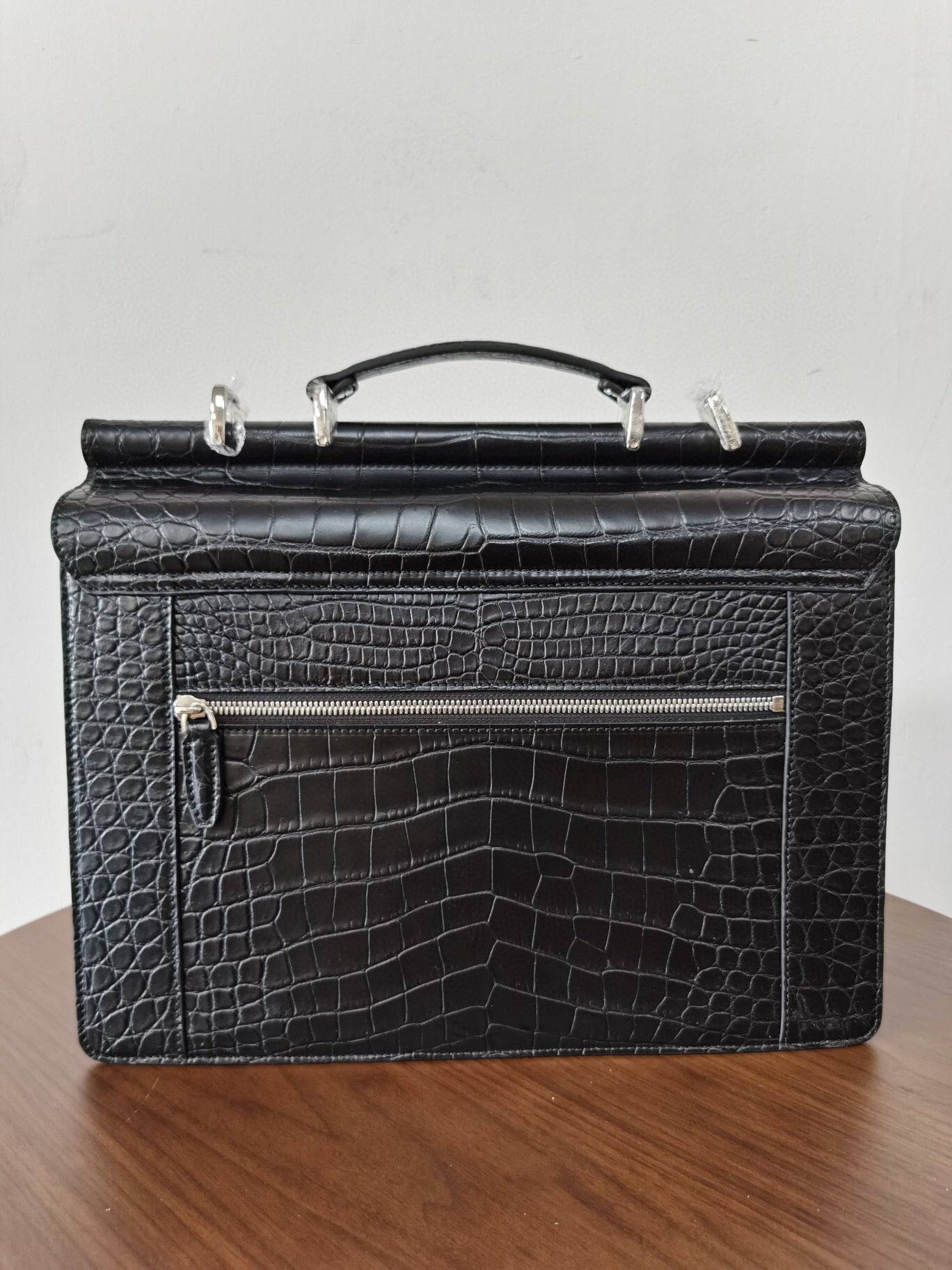 Black crocodile leather Rossie Viren business briefcase with sleek, structured design and sturdy handles.