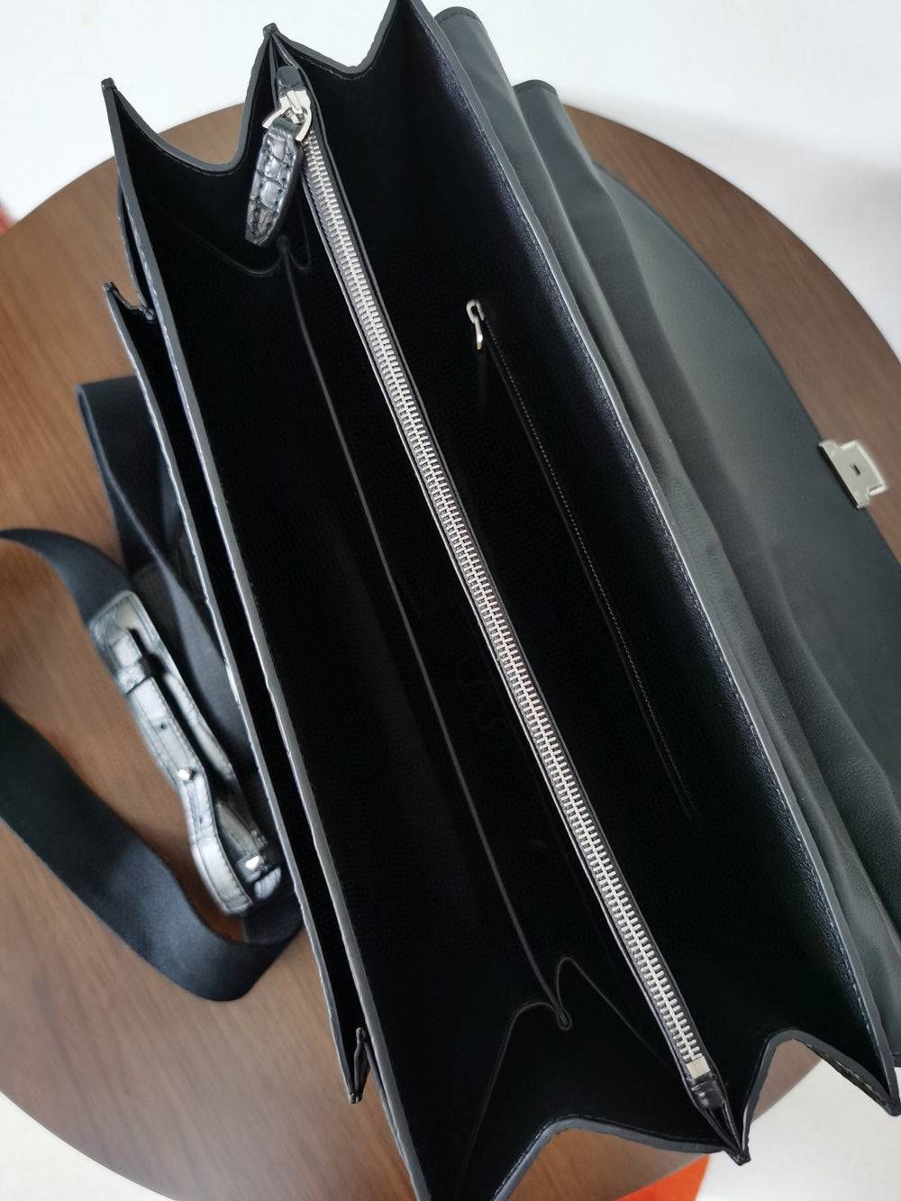 Black crocodile leather business briefcase by Rossie Viren, featuring a sleek and professional handbag design with sturdy handles.