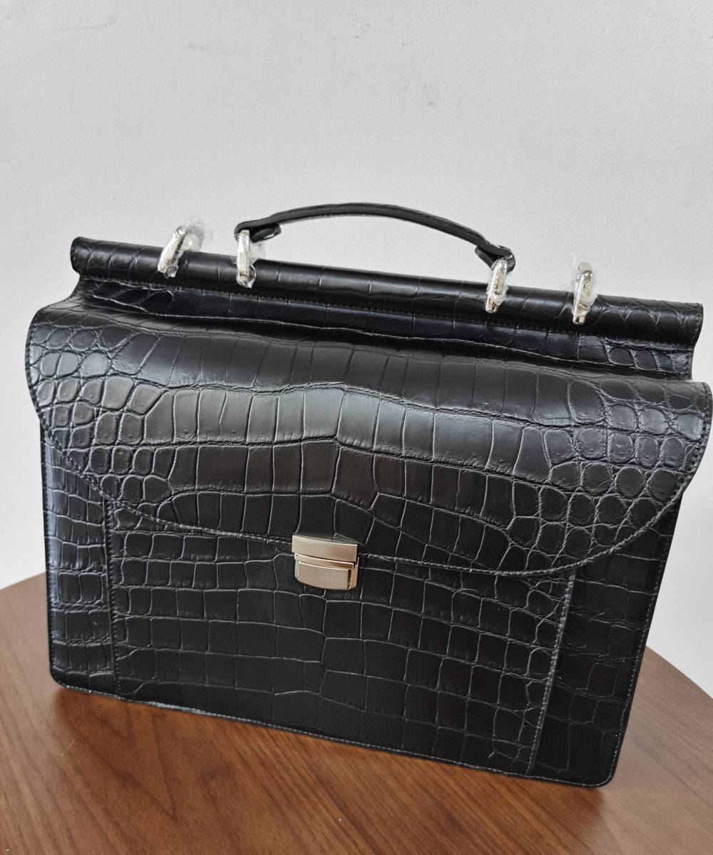 Black crocodile leather business briefcase by Rossie Viren, featuring a sleek, professional handbag design with sturdy handles.