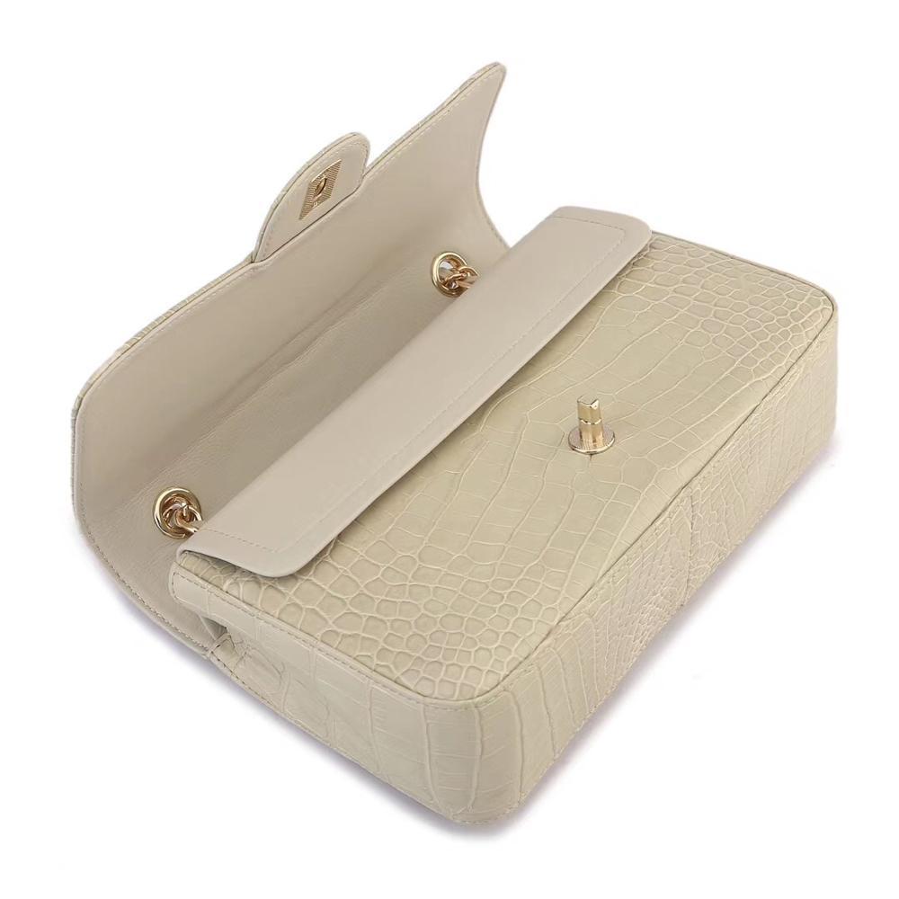 Beige crocodile leather shoulder handbag with classic flap and chain strap for women by Rossie Viren.