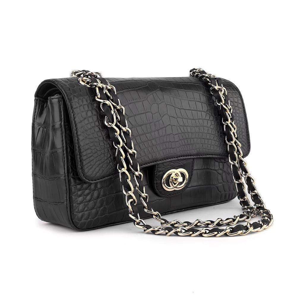 Black crocodile leather shoulder handbag with a classic flap and chain strap by Rossie Viren.