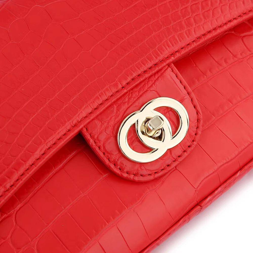 Red crocodile leather shoulder handbag with a classic flap and chain strap by Rossie Viren, stylish and elegant for women.