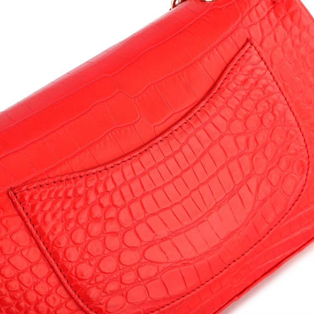 Red crocodile leather shoulder handbag with classic flap and chain strap by Rossie Viren, designed for women.