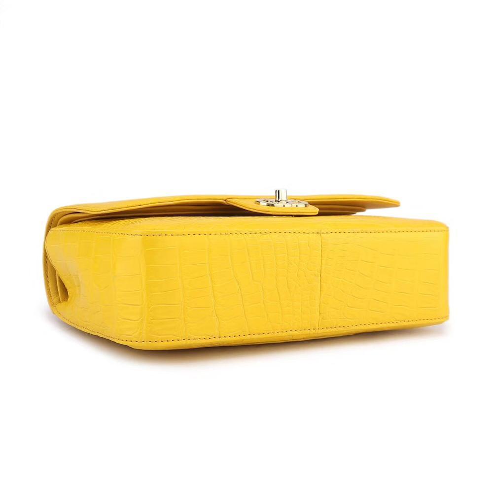Yellow crocodile leather shoulder handbag with classic flap and chain strap by Rossie Viren, stylish for women.