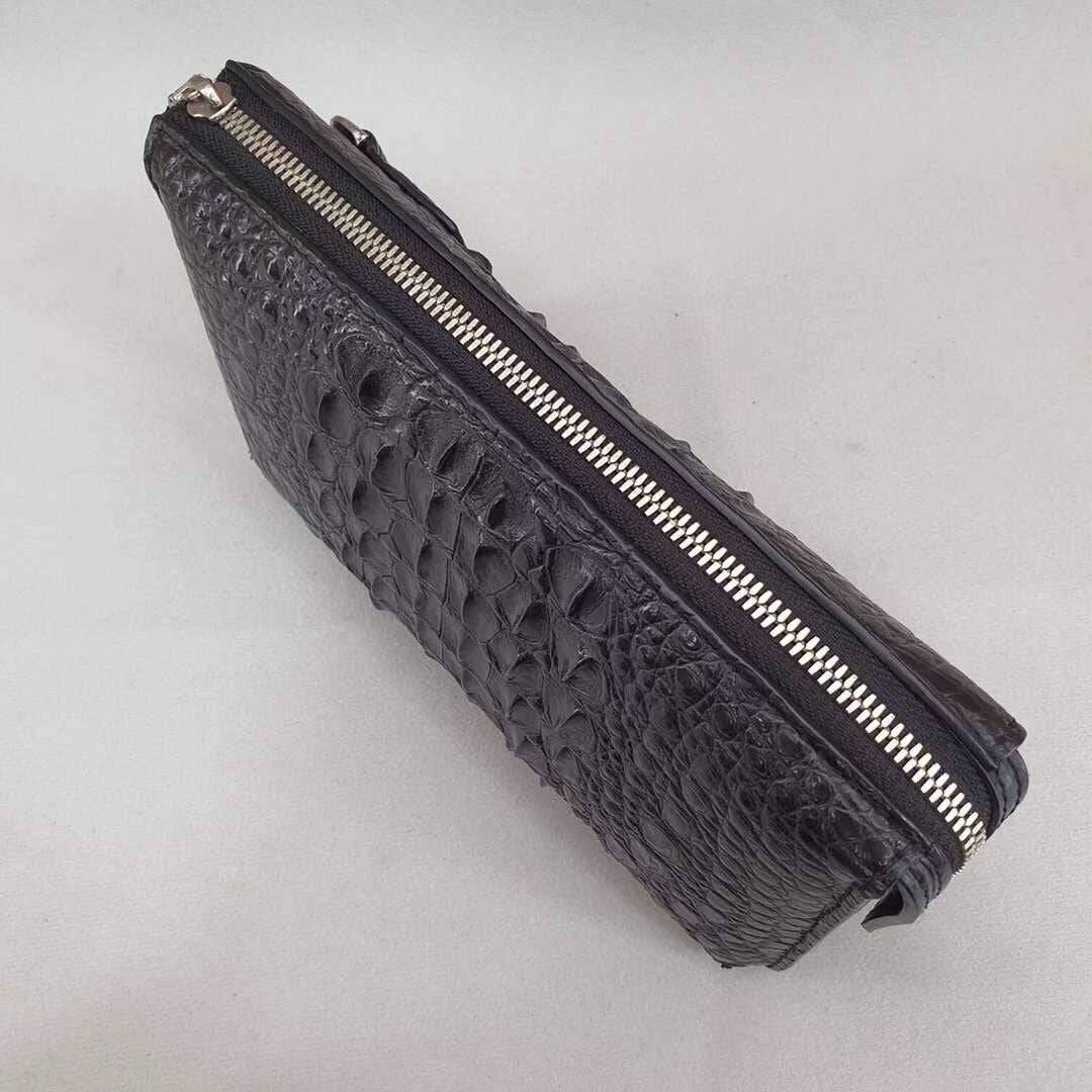 Rossie Viren crocodile bone leather clutch bag with sleek design and textured crocodile pattern, perfect for stylish occasions.