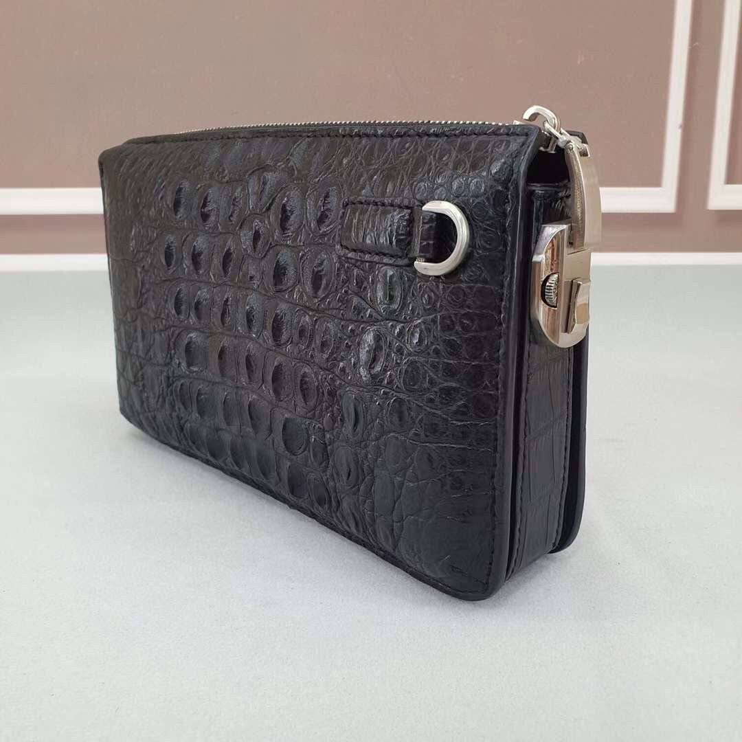 Rossie Viren crocodile bone leather clutch bag with sleek design and textured crocodile pattern, featuring a compact, elegant style.