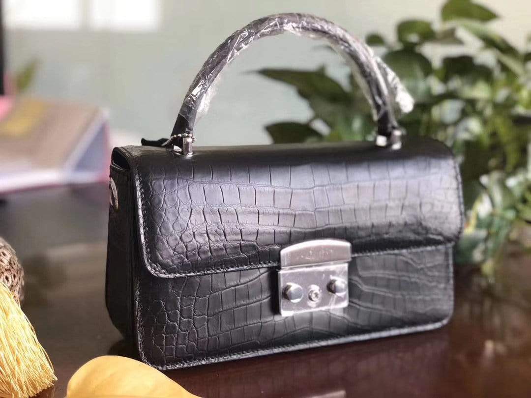 Rossie Viren crocodile leather crossbody messenger handbag with top handle, featuring a sleek, textured crocodile pattern.