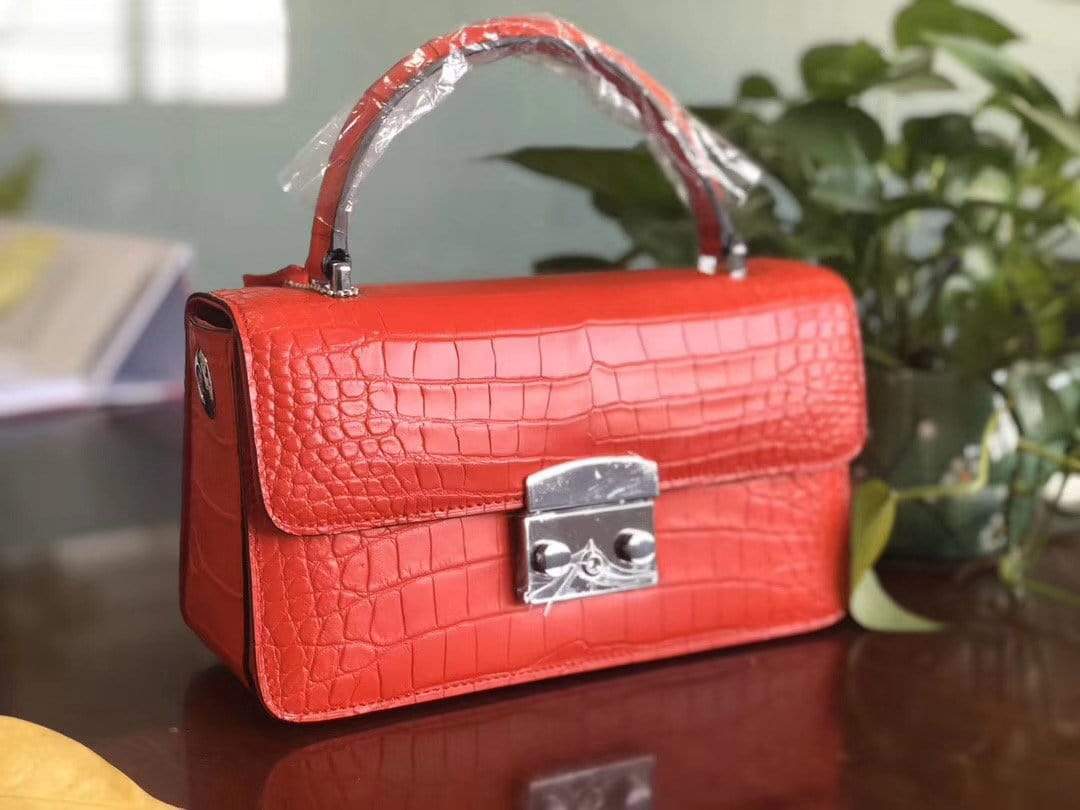 Rossie Viren crocodile leather cross-body messenger handbag with top handle, featuring a sleek and stylish design.