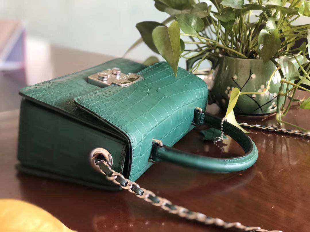 Rossie Viren crocodile leather crossbody messenger handbag with top handle, featuring a sleek, textured design and gold-tone hardware.