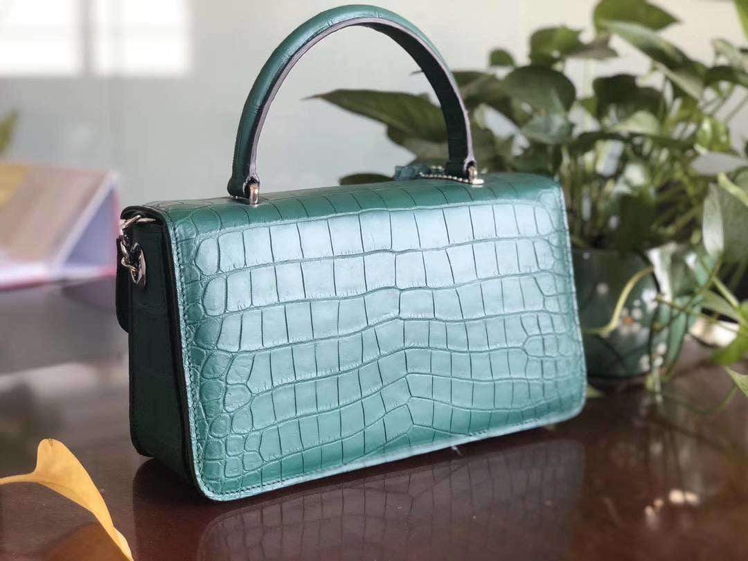 Rossie Viren crocodile leather cross body messenger handbag with top handle, featuring a sleek and stylish design.
