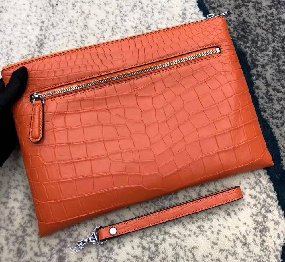 Elegant Rossie Viren crocodile leather envelope clutch bag with sleek design and textured surface for sophisticated style.
