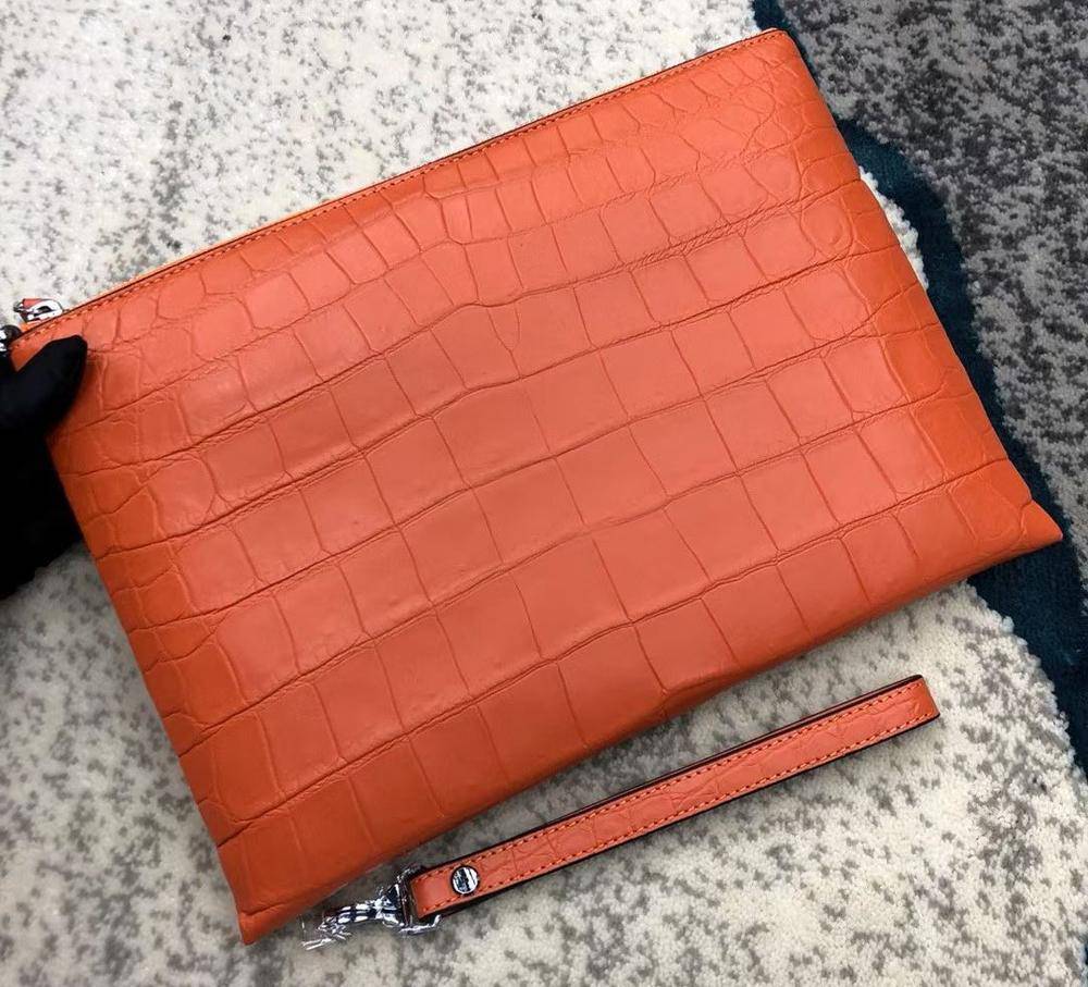 Rossie Viren crocodile leather envelop clutch bag with sleek design and textured crocodile pattern, perfect for elegant occasions.