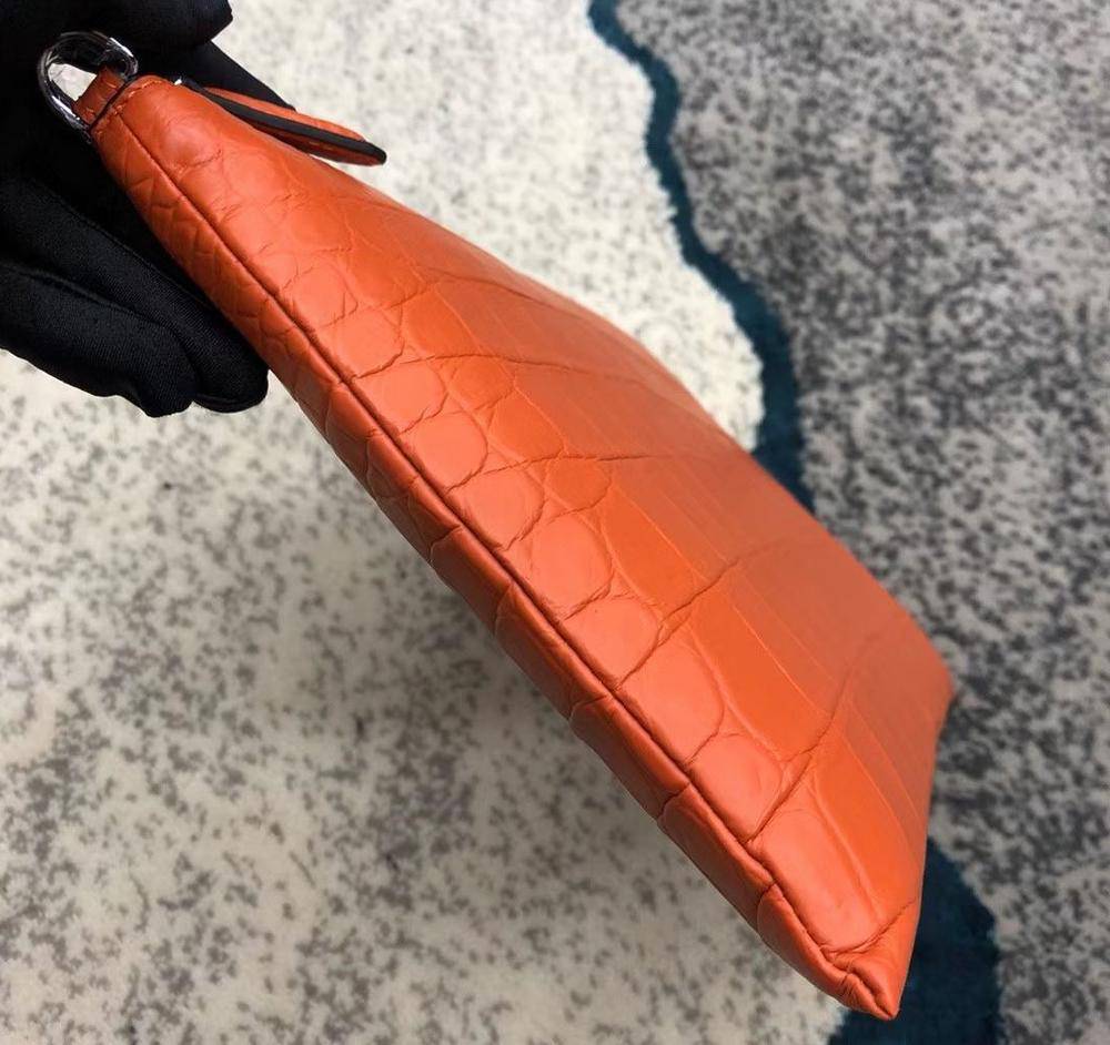 Rossie Viren crocodile leather envelope clutch bag with sleek design and textured crocodile pattern, perfect for elegant occasions.
