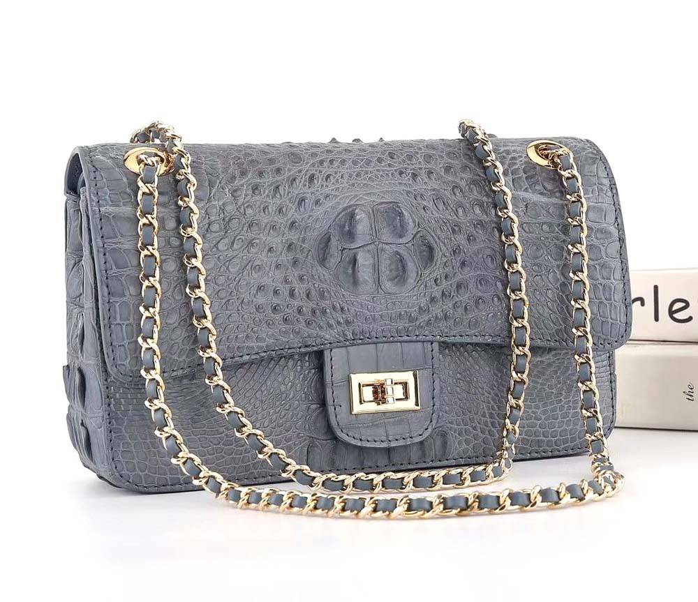 Dark grey crocodile leather flap chain shoulder bag by Rossie Viren, featuring a structured handbag design with a chain strap.