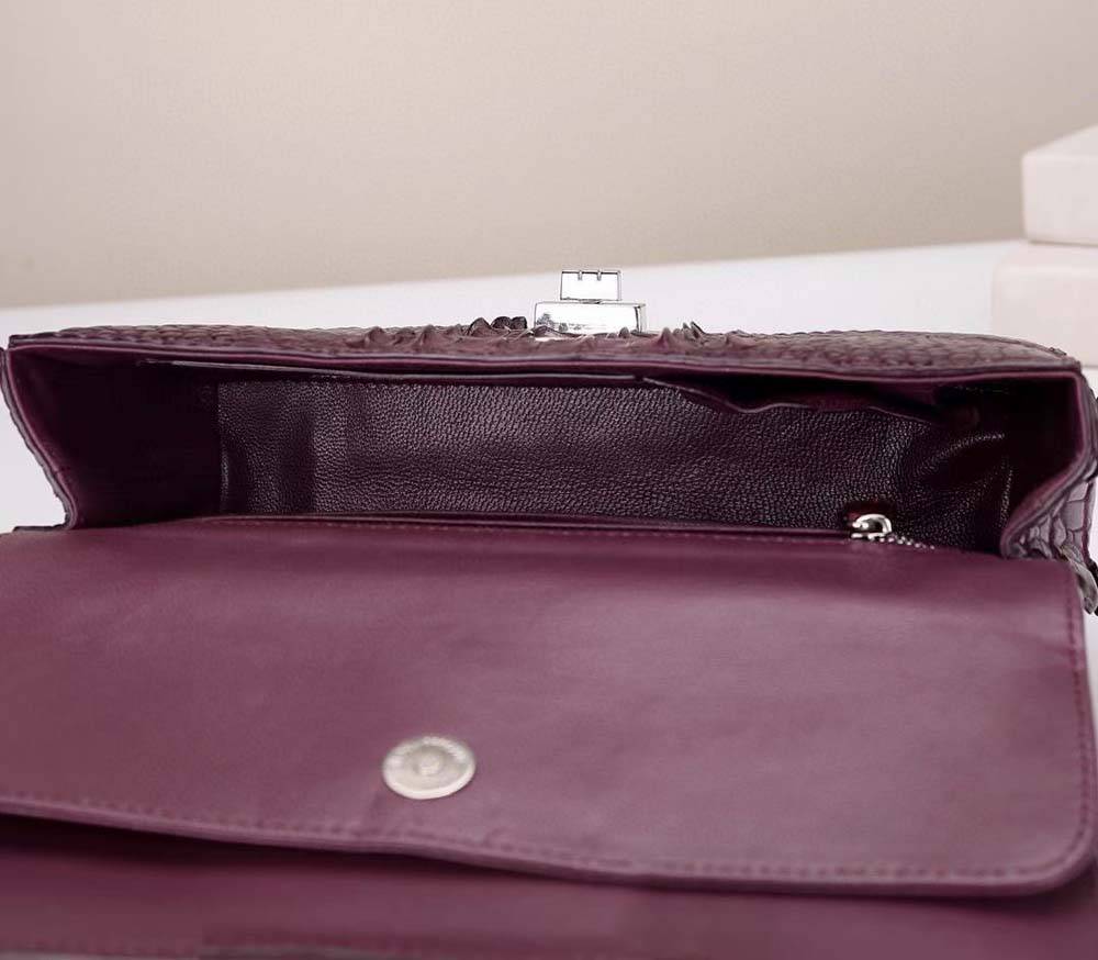 Wine red crocodile leather flap chain shoulder bag by Rossie Viren with gold-tone hardware and adjustable strap.