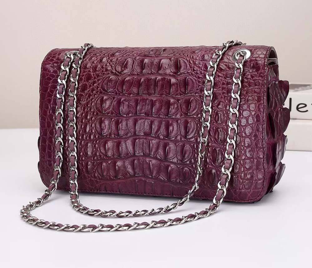 Wine red crocodile leather flap chain shoulder handbag by Rossie Viren with elegant design and gold chain strap.