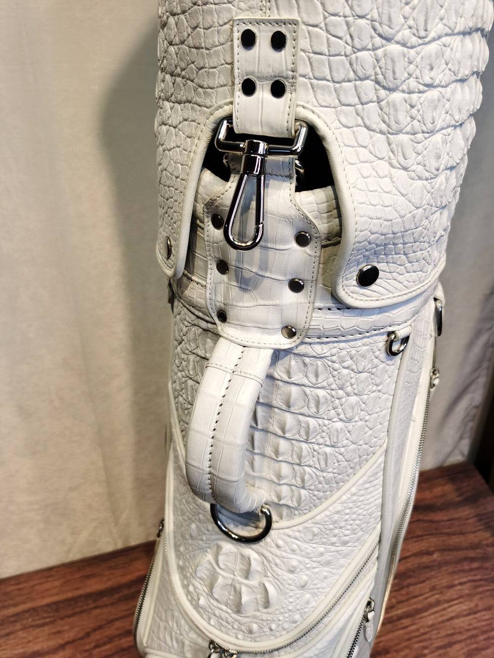 White Crocodile Bone Leather Golf Bag from Rossie Viren, featuring a golf set with cart and stand golf bags.