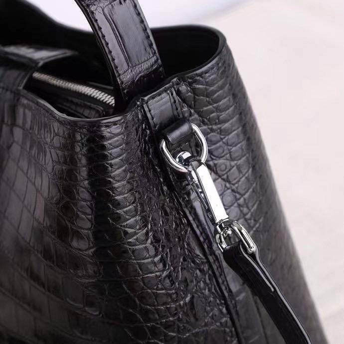 Rossie Viren crocodile leather hobo shoulder bag with barrel shape, crossbody strap, and classic messenger style.