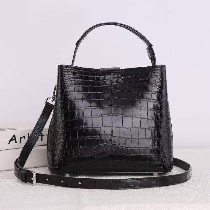 Rossie Viren crocodile leather hobo shoulder bag with barrel crossbody design, featuring a stylish and textured handbag silhouette.