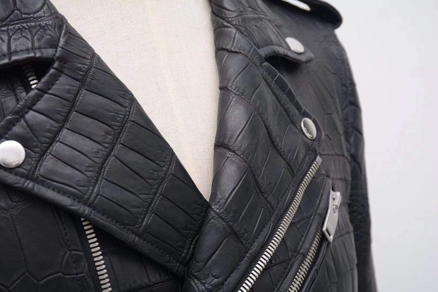 Black crocodile leather motorcycle jacket by Rossie Viren, slim fit racer style for men and women, featuring detailed crocodile texture.