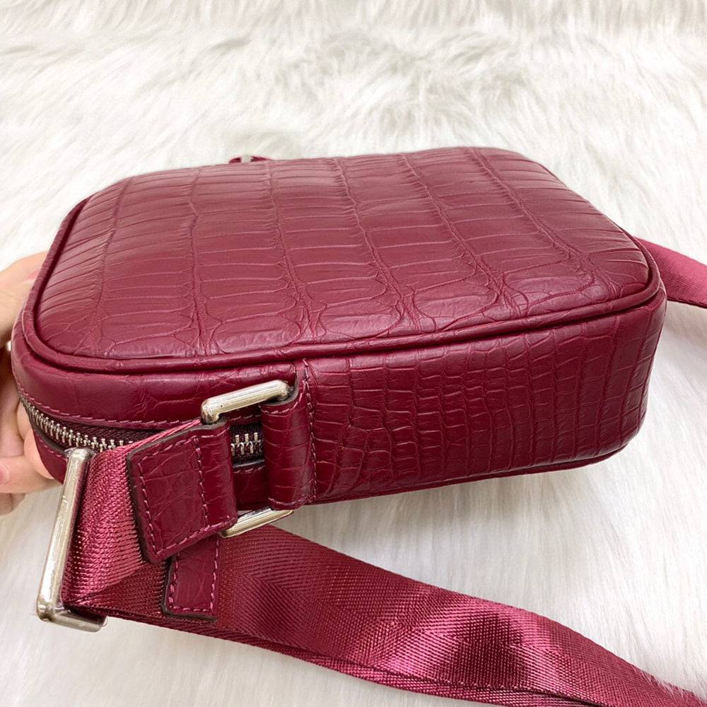 Rossie Viren crocodile leather small crossbody shoulder bag with sleek design and adjustable strap.