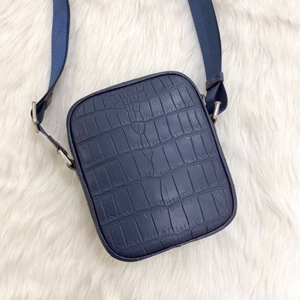 Crocodile leather small crossbody shoulder bag by Rossie Viren, featuring a compact design and elegant texture.