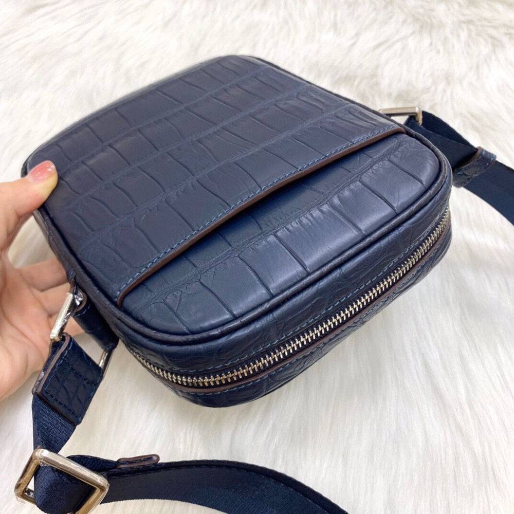 Rossie Viren crocodile leather small crossbody shoulder bag with sleek design and adjustable strap.