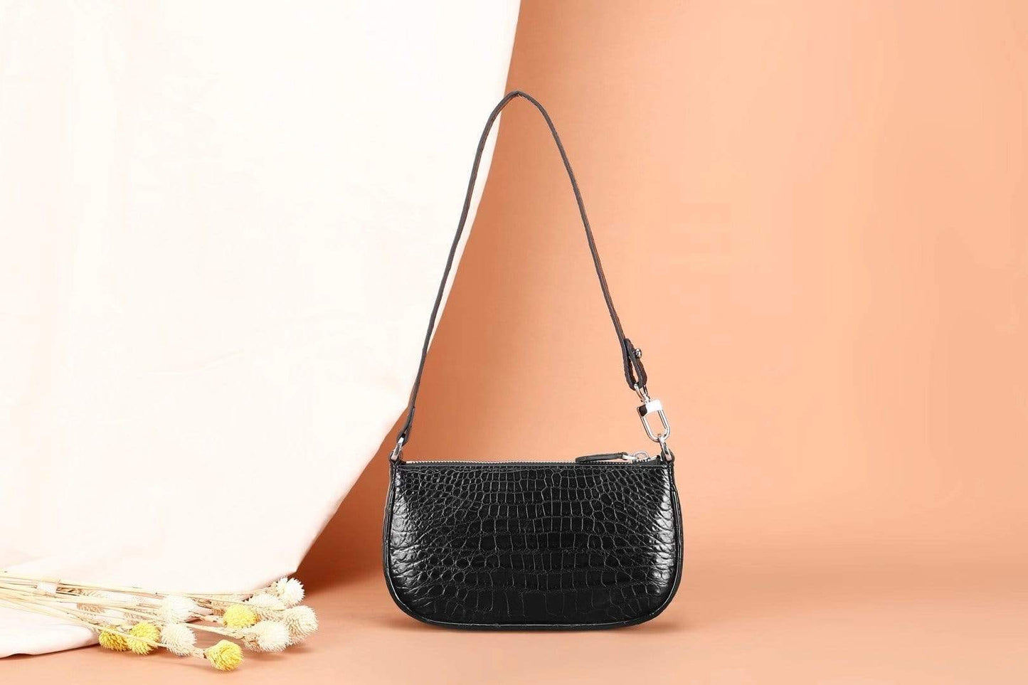 Rossie Viren crocodile leather underarm shoulder handbag showing textured crocodile pattern and sleek design.