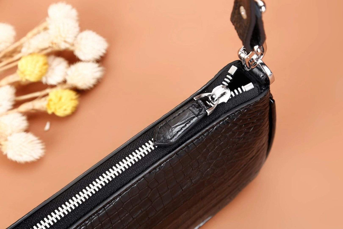 Rossie Viren crocodile leather underarm shoulder handbag with sleek design and textured crocodile pattern.