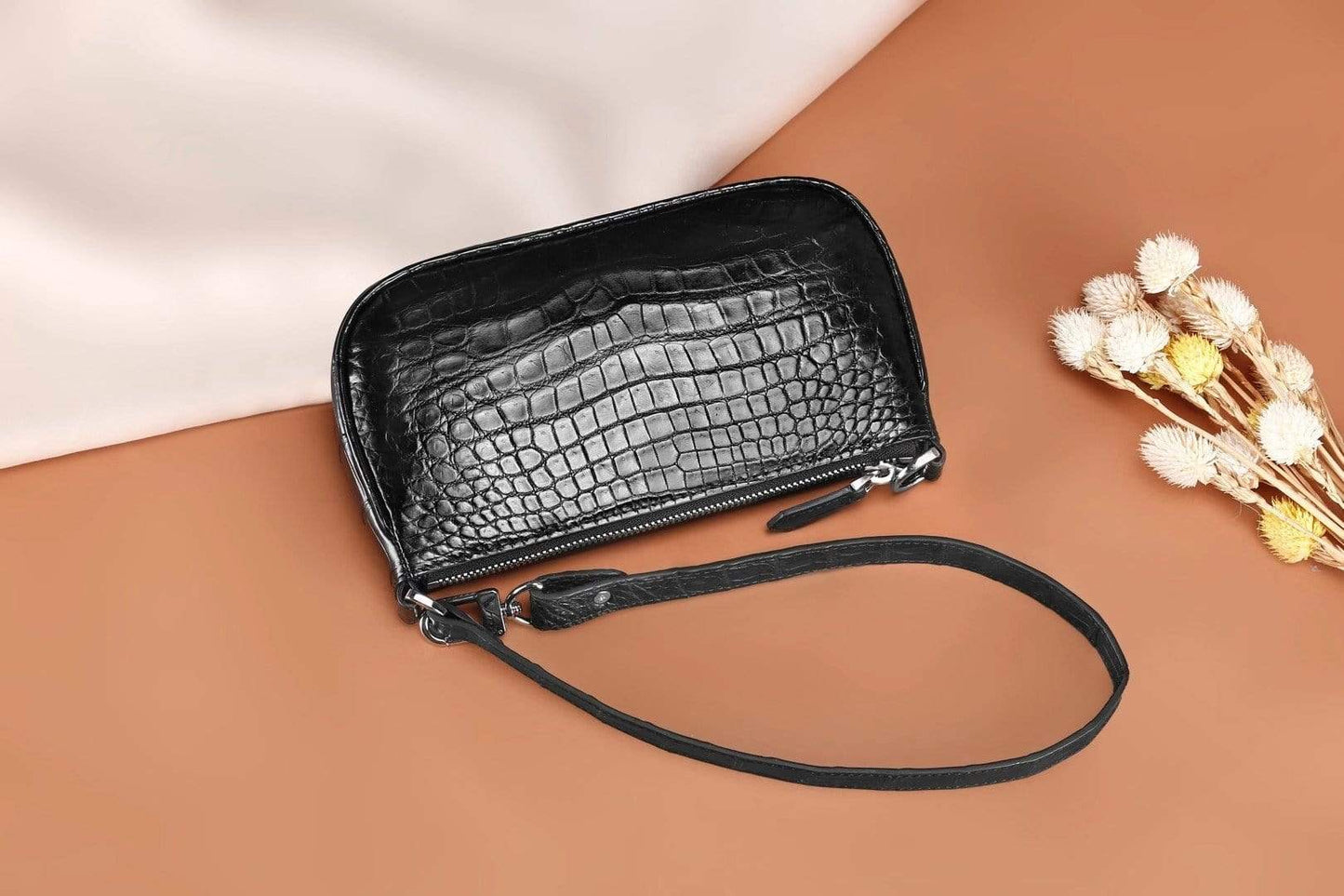 Crocodile leather underarm shoulder handbag by Rossie Viren, featuring a sleek design and textured crocodile pattern.
