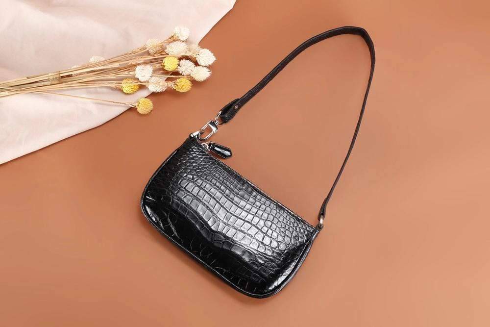 Rossie Viren crocodile leather underarm shoulder handbag with sleek design and textured crocodile pattern.