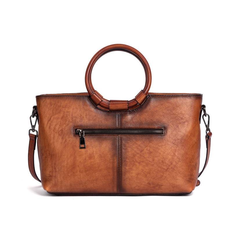 Rossie Viren women's vintage leather shoulder tote bag with large capacity and round handle, stylish and functional handbag.