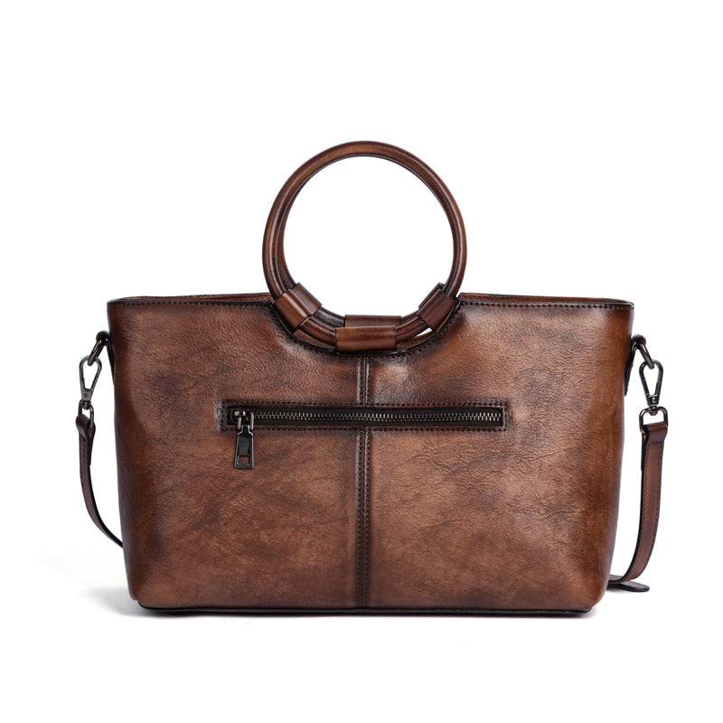Rossie Viren women's vintage leather shoulder tote bag with large capacity, round handle, and stylish design.