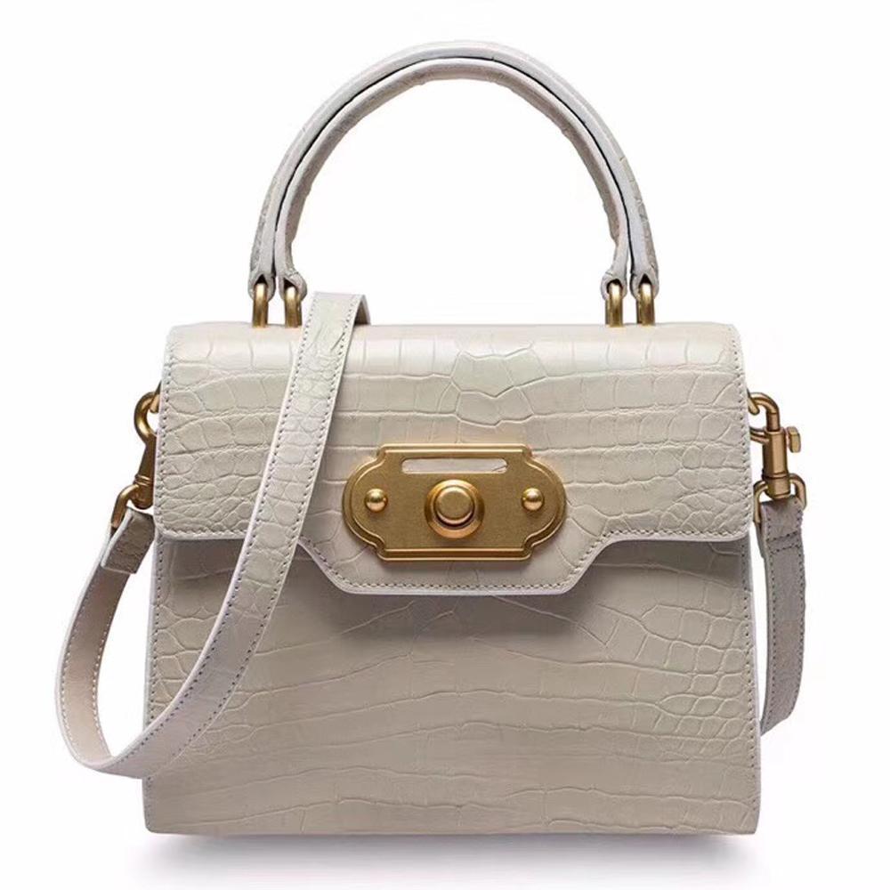 Genuine crocodile belly leather top handle shoulder purse bag by Rossie Viren with elegant craftsmanship and textured crocodile pattern.