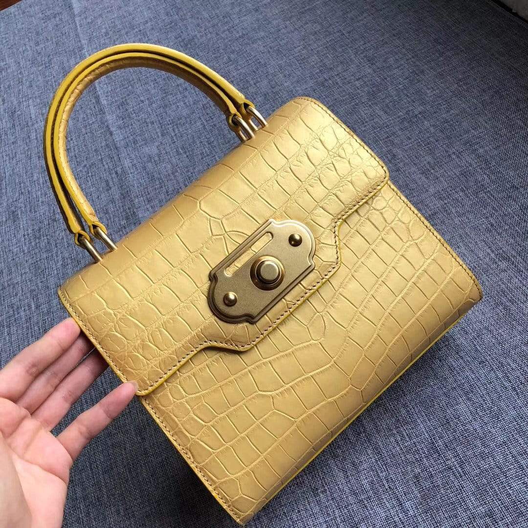Genuine crocodile belly leather top handle shoulder purse bag by Rossie Viren with a sleek, structured design and gold-tone hardware.