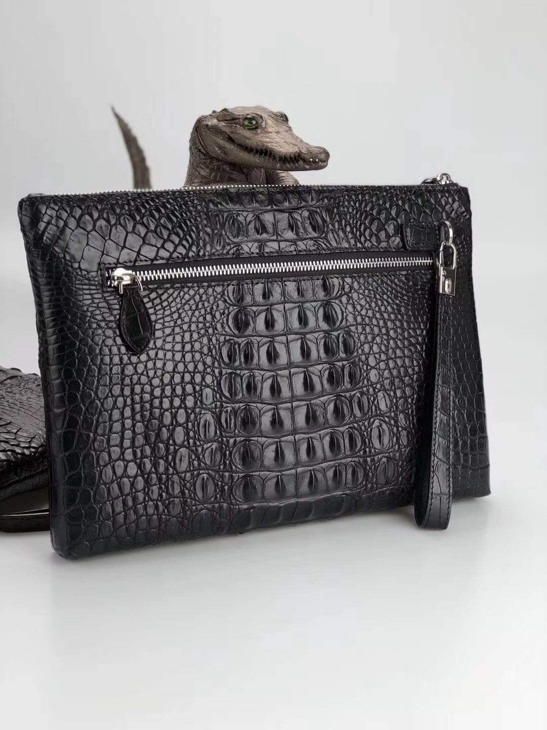 Rossie Viren genuine crocodile bone leather medium iPad clutch bag showing textured surface and elegant design.