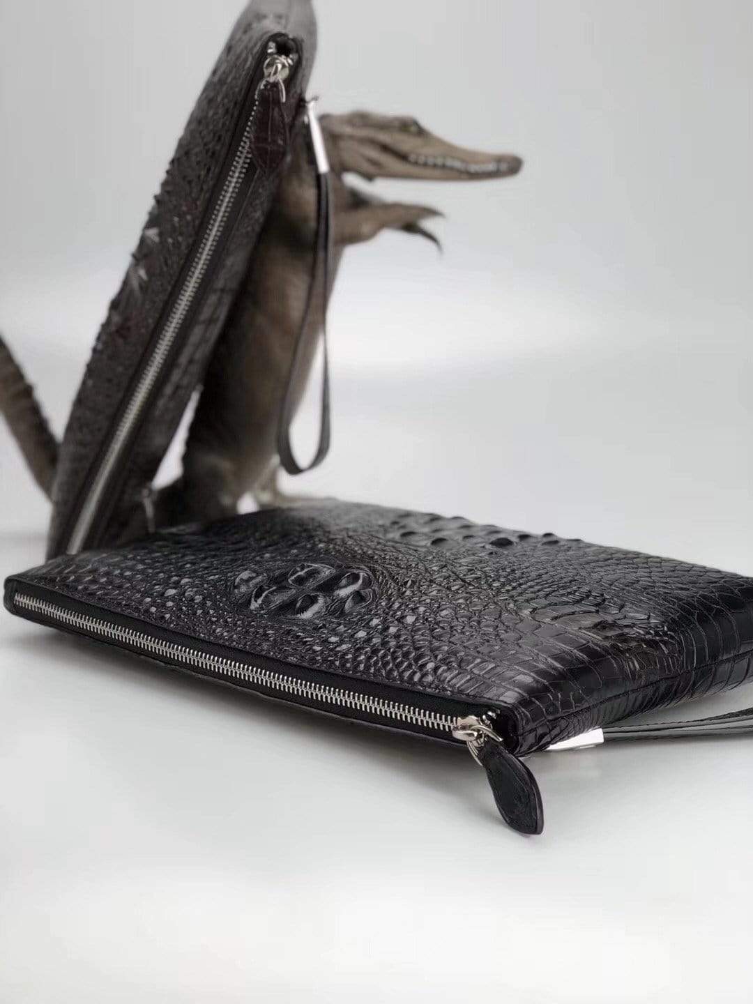 Genuine crocodile bone leather medium iPad case and clutch bag by Rossie Viren with sleek, textured design and secure closure.