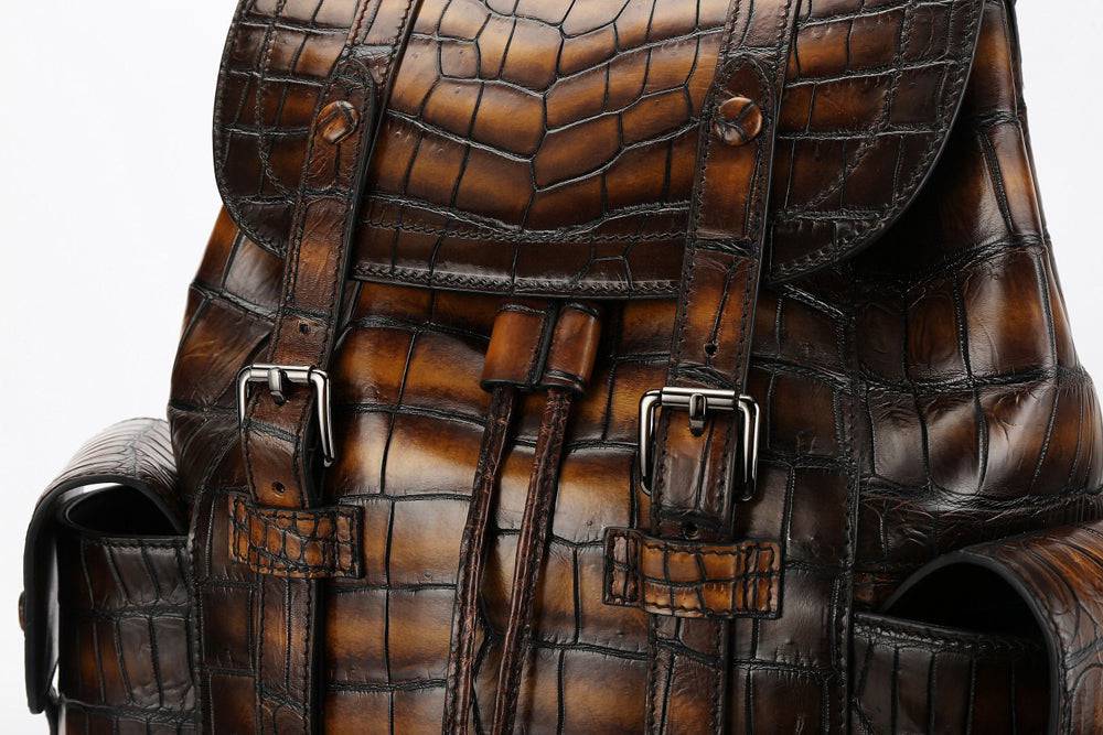 Genuine crocodile leather handbag by Rossie Viren, showcasing a sleek and textured crocodile pattern with sturdy handle and compact design.