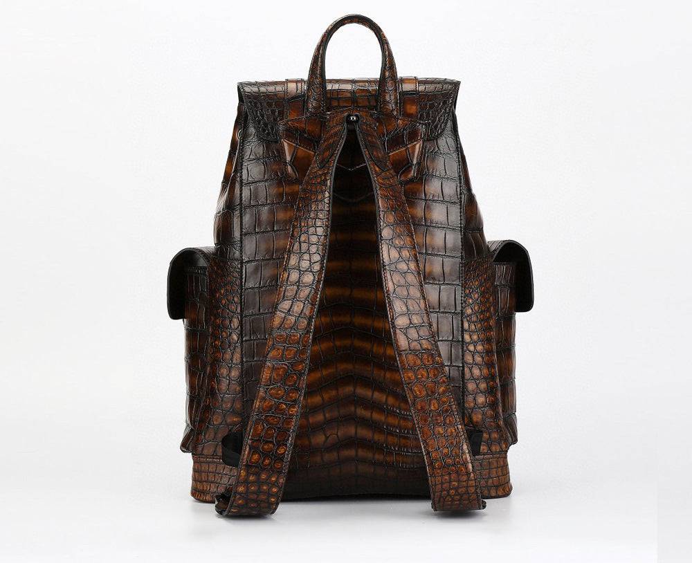Genuine crocodile leather handbag by Rossie Viren featuring a structured design with a top handle and adjustable shoulder strap.