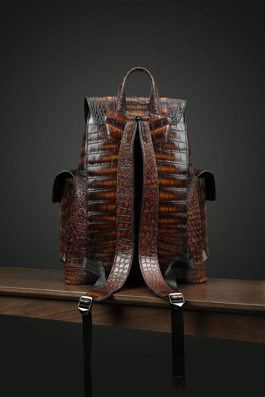 Genuine crocodile leather handbag by Rossie Viren with a structured design and top handle, showcasing luxurious texture and craftsmanship.